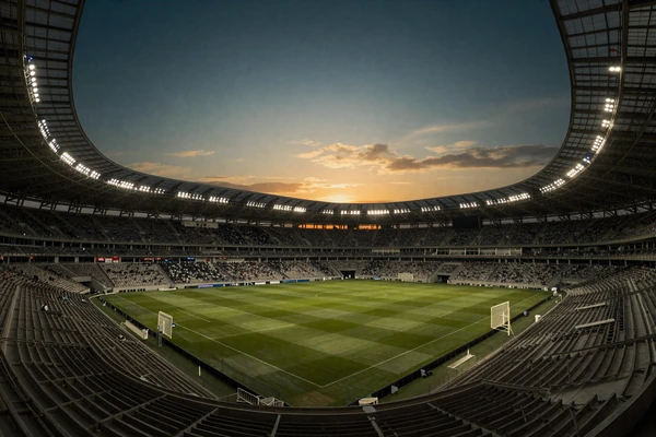 Fu&szlig;ballstadion bei Nacht mit Flutlicht und leerem Spielfeld f&uuml;r Sportwetten bei Cleobetra Casino